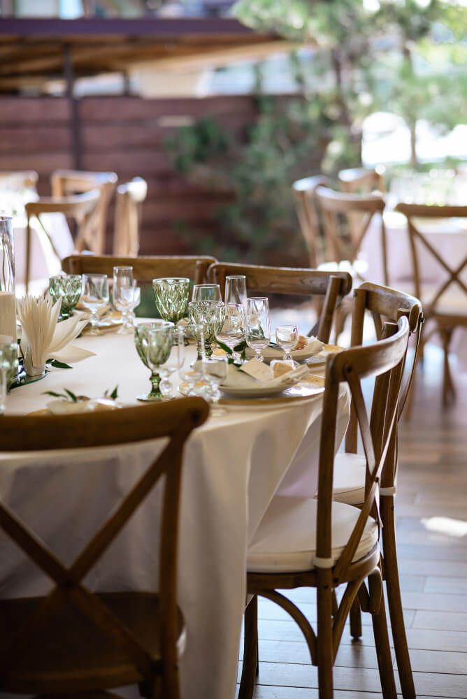 white-table-with-tableware-chairs-made-wood