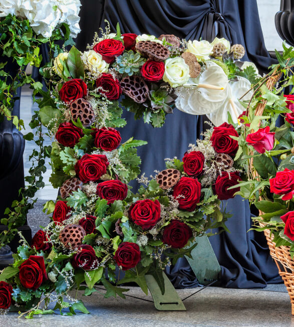 funeral-beautifully-decorated-with-flower-arrangements-coffin-close-up (1)